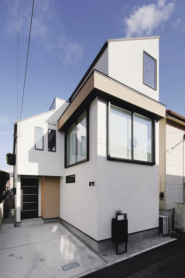 ジェネシス 【延床27.2坪/間取り図/狭小/吹き抜け/屋上/3階建て】憧れの輸入キッチンが映える開放的な広々リビングの家の建築実例画像10