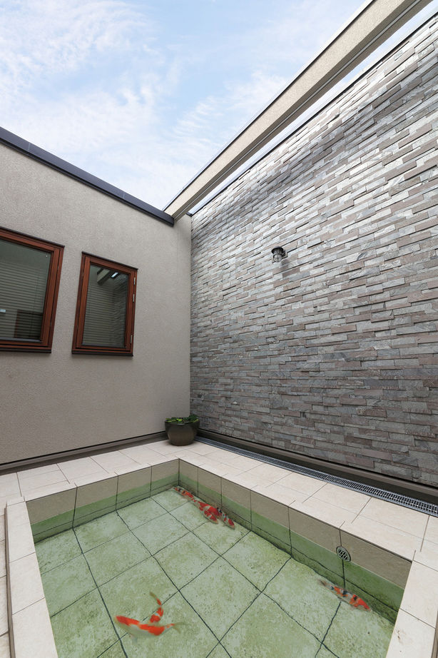 三菱地所ホーム リビングの大空間を実現した平屋風2階建て。全館空調で24時間換気しながら室内は季節を問わず快適の建築実例画像9