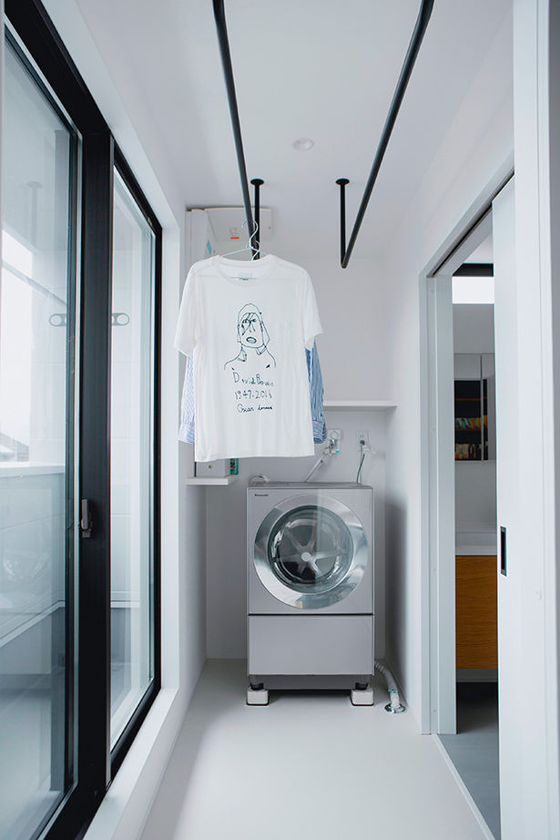 ALTS DESIGN OFFICE（アルツ　デザイン　オフィス） ≪滋賀県/間取り図有≫お気に入りの絵画が映える美術館のような玄関ホールとコンクリート土間がある住まいの建築実例画像13