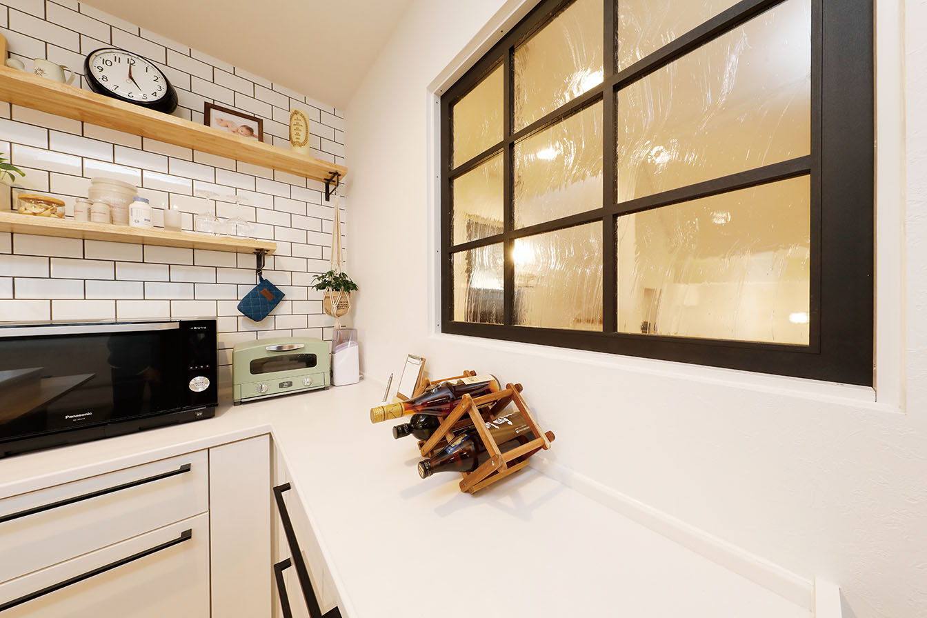 三心 【3000万円台/吹き抜け/ウッドデッキ/ロフト/2階LDK】木造とRC造で建て替えた地下ガレージのある二世帯住宅の建築実例画像4