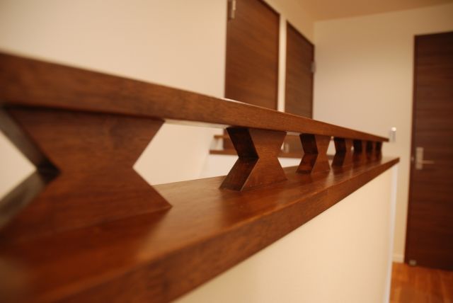 アルファホーム／オーガニックハウス新潟 レンガタイルと塗り壁のコントラストが美しい外観。自然素材と造作家具を採用した全館空調のデザイン住宅の建築実例画像8