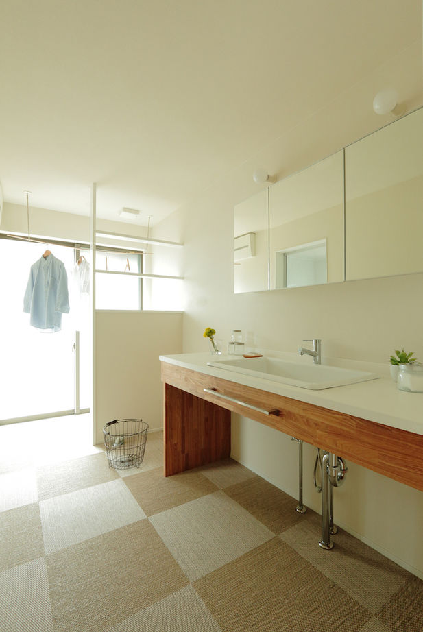 iKKA 【滋賀県湖南/間取り図有】平家のような佇まいが魅力。土地の高低差を活かしたスキップフロアで繋がる家の建築実例画像9