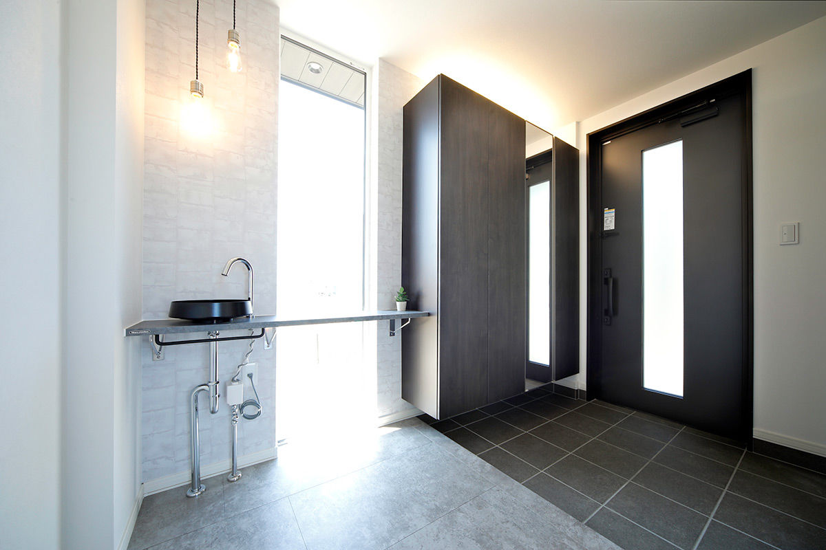 豊栄建設 【苫小牧市/吹抜け】玄関を入ると開放的な大空間。個々の時間を過ごす遊び心と家族の集いを感じる住まいの建築実例画像9