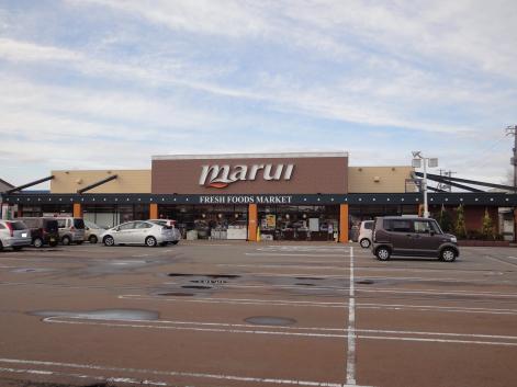 スーパー　スーパーマルイ塚野目店（スーパー）まで867m