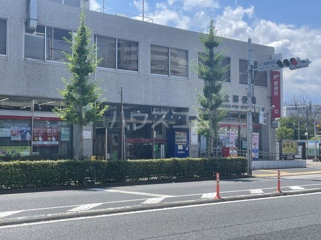 郵便局　足立郵便局（郵便局）まで518m
