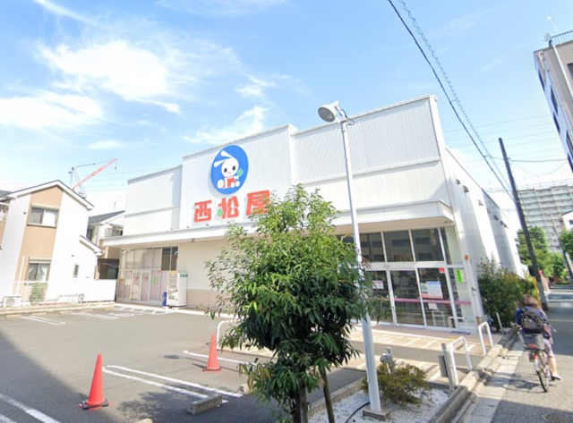 ショッピングセンター　西松屋足立梅島店（ショッピングセンター）まで558m