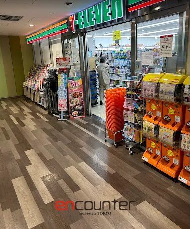 コンビニ　セブンイレブンAIM日本医科大学付属病院店（コンビニ）まで210m