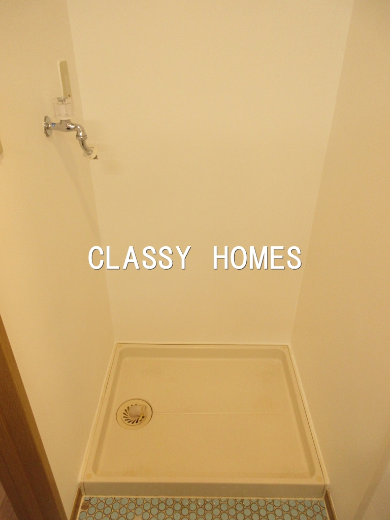 その他部屋・スペース　1998年竣工　カステーロミズタニ：洗濯機置き場