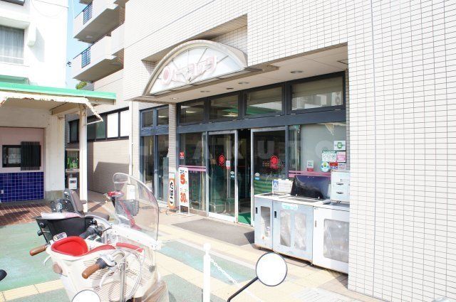 スーパー　大丸ピーコックストア　千里南町プラザ店（スーパー）まで446m