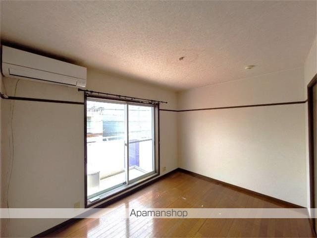 JOY COURT A棟の居間写真