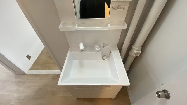 洗面設備　１号棟のモデルルームの写真です