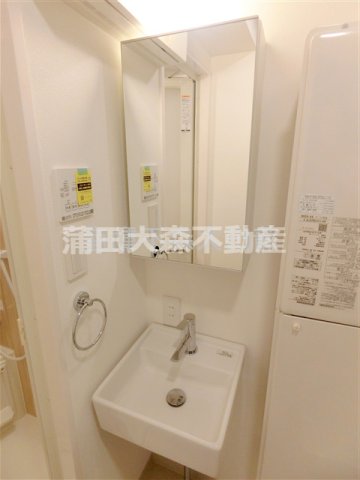 洗面設備　洗面脱衣所　鏡裏収納の独立洗面台
