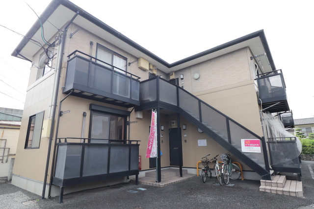 建物外観　住いの快適をサポート。２４時間／年中無休の電話受付サービス。