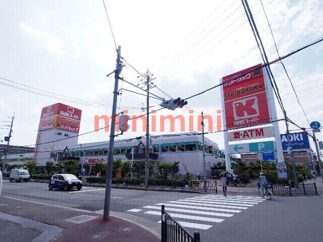ドラックストア　スギ薬局高槻西冠店（ドラッグストア）まで596m