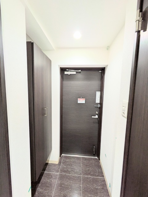 玄関　クリーニング前の写真です