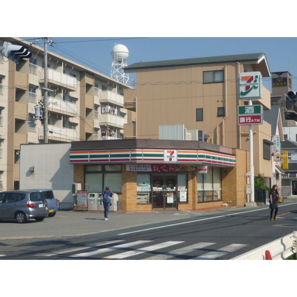 コンビニ　セブンイレブン明石西江井が島駅前店（コンビニ）まで324m