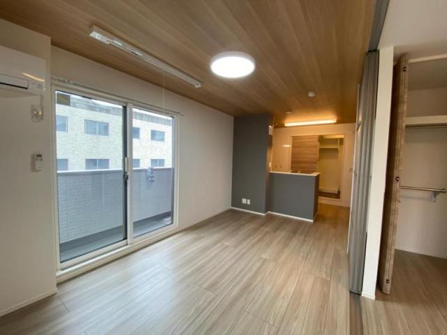 アパッショナート東浜の居間写真