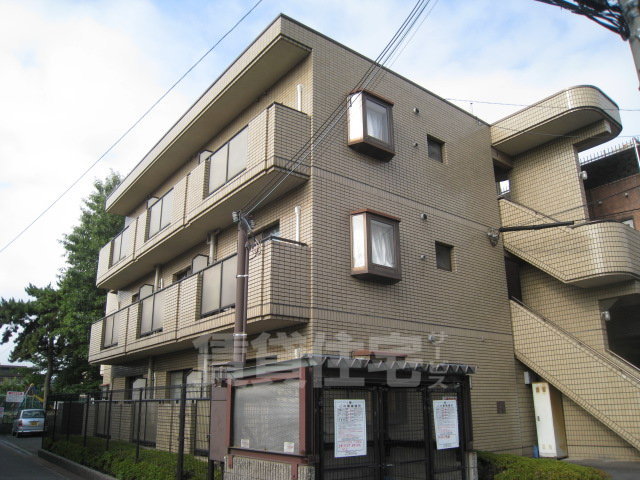 茨木市沢良宜西のマンションの建物外観