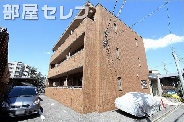 建物外観　茶色のタイル張りのおしゃれなマンション