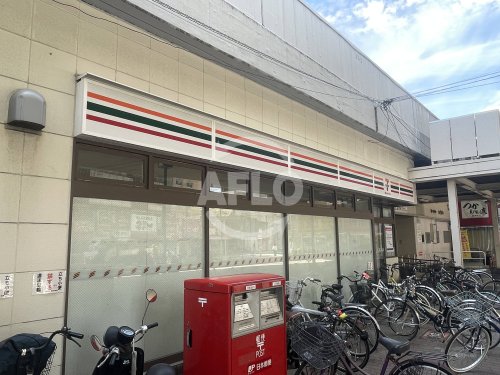 コンビニ　セブン-イレブン ハートインJR塚本駅西口店（コンビニ）まで100m