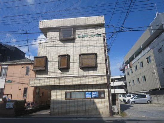 【鶴ヶ島市大字鶴ヶ丘のマンションの建物外観】