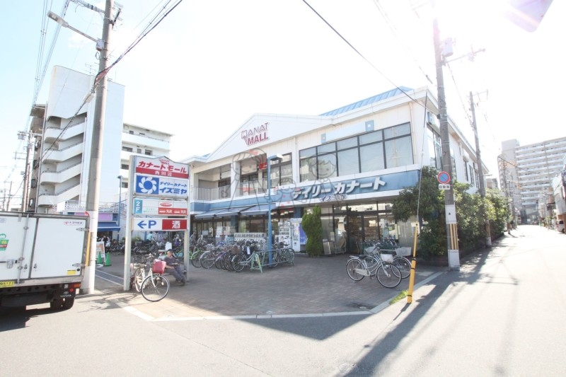 スーパー　デイリーカナートイズミヤ西田辺店（スーパー）まで243m