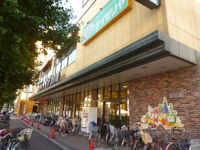 スーパー　コモディイイダ食彩館桜川店（スーパー）まで521m
