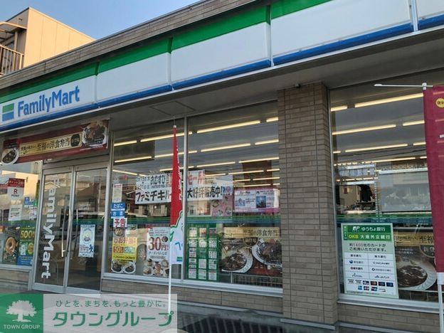 コンビニ　ファミリーマート名西名塚町店（コンビニ）まで390m