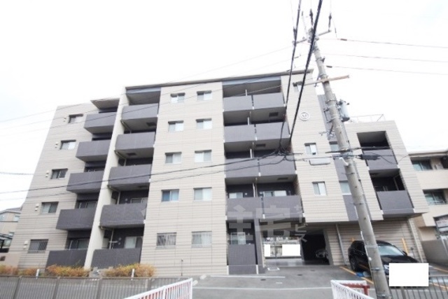 【生駒市谷田町のマンションの建物外観】