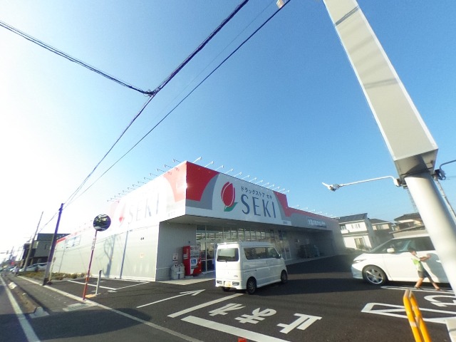 ドラックストア　ドラッグストアセキ 東間店（ドラッグストア）まで385m