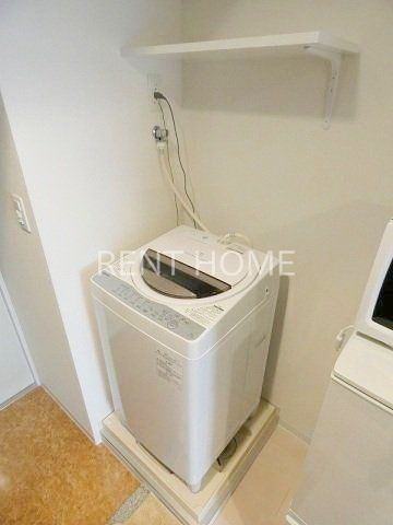その他　洗濯機は残地物です