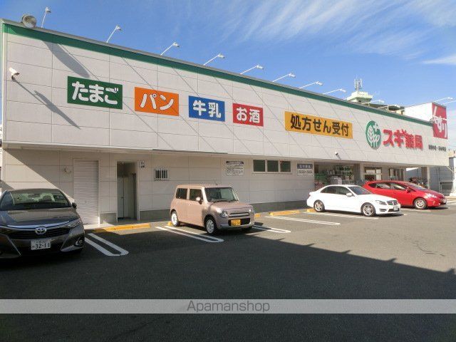 ドラックストア　スギ薬局南千里店（ドラッグストア）まで406m
