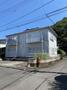 建物外観　閑静な住宅街の角地にある「ハーモニアメゾン」は陽当たり良好で