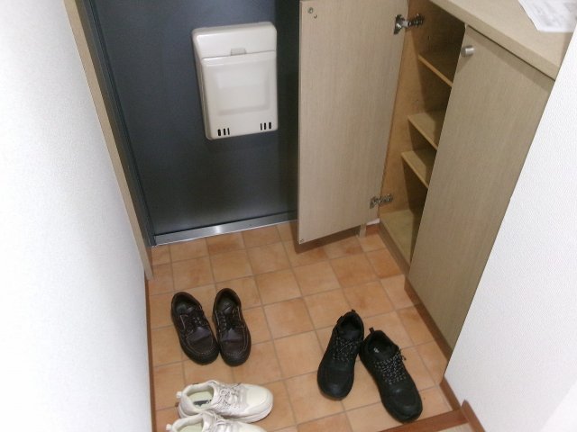 フェリスメンテ狩口台の玄関写真