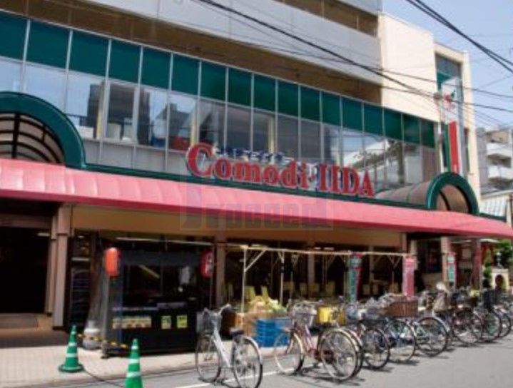 スーパー　コモディイイダ滝野川店（スーパー）まで390m