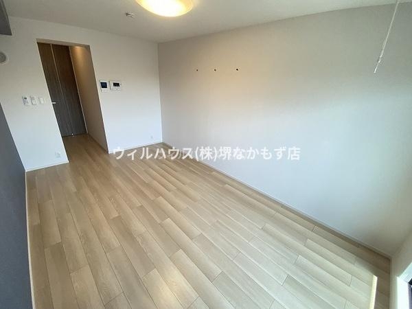 ヒカルサ堺市文珠橋通1の居間写真