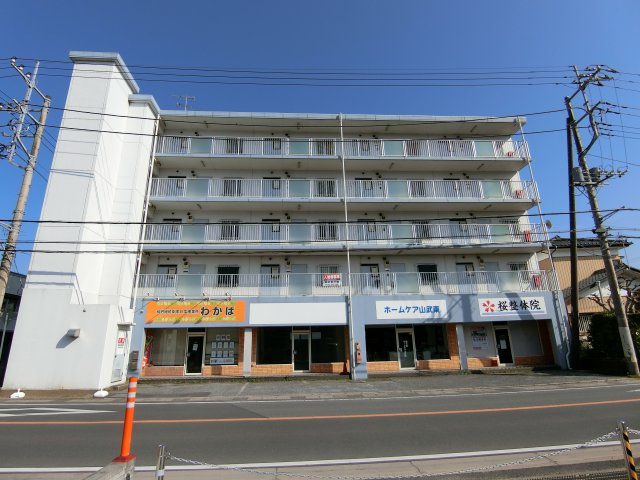 【山武市松尾町大堤のマンションの建物外観】