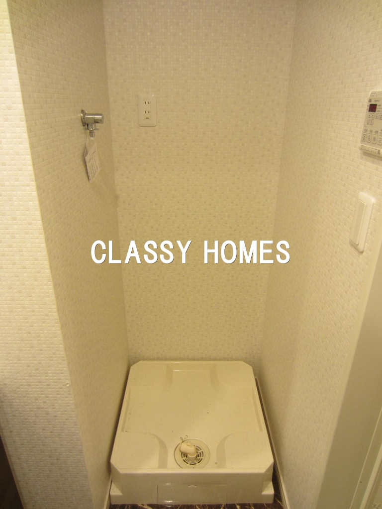 その他設備　2018年竣工　ウェルスクエアイズム大井町：洗濯機置き場