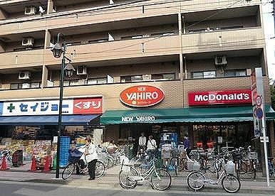 スーパー　ニューヤヒロパルケ稲田堤駅前店（スーパー）まで877m
