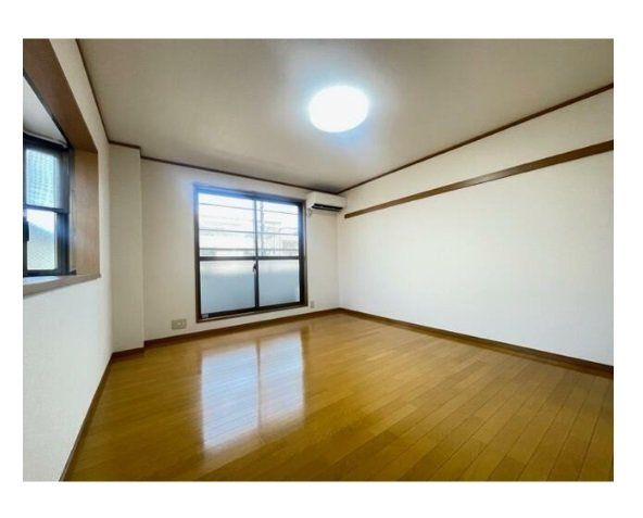 小田急線 登戸駅 徒歩12分 3階建 築24年の居間写真