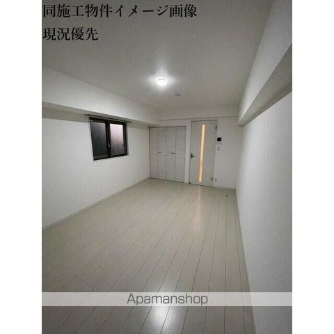 ヒルズ馬橋IIの居間写真