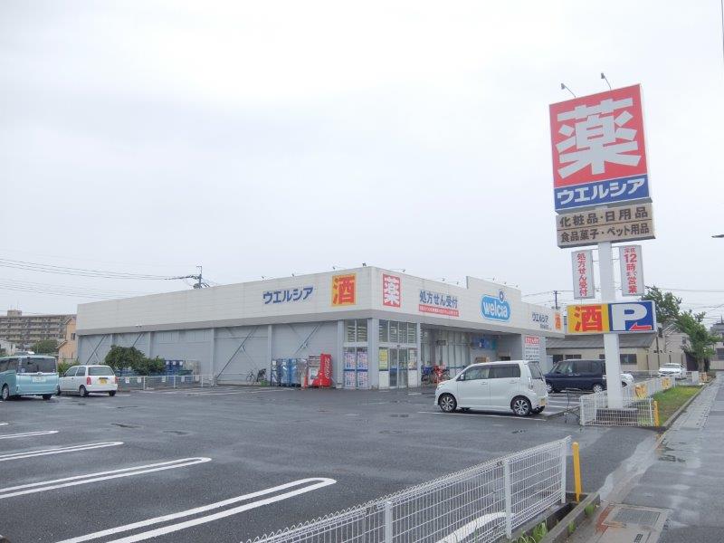 ドラックストア　ウエルシア草加金明店（ドラッグストア）まで291m
