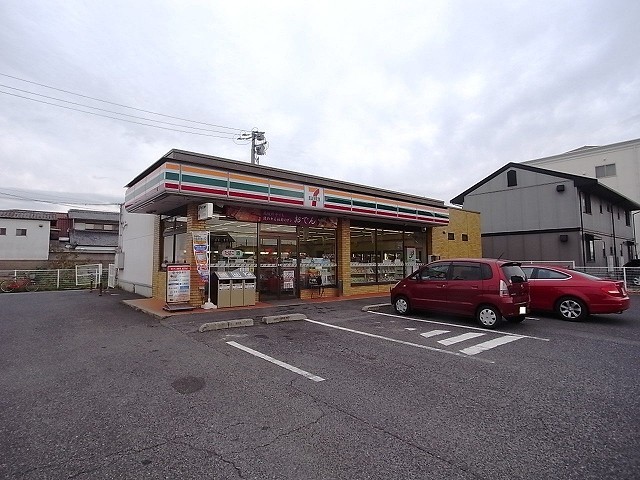 コンビニ　セブンイレブン倉敷新田店（コンビニ）まで877m