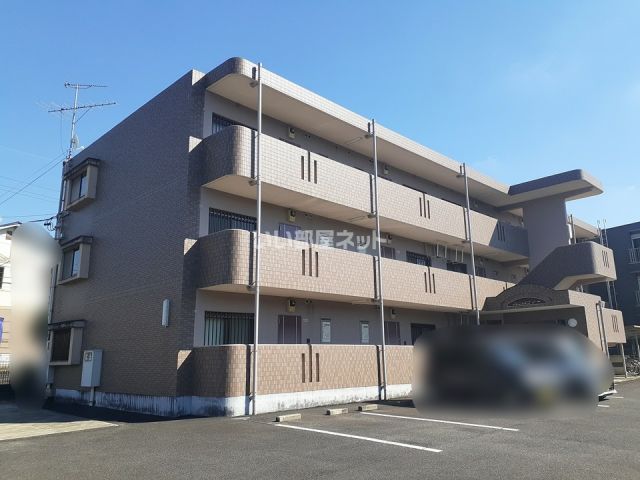 名張市鴻之台３番町のマンションの建物外観