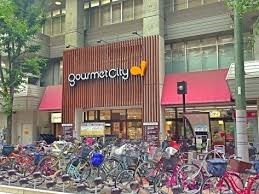 スーパー　グルメシティ江坂店（スーパー）まで427m