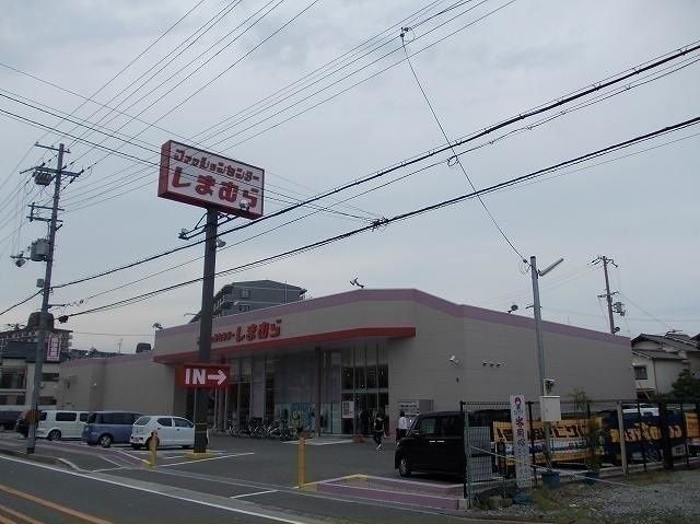 ショッピングセンター　ファッションセンターしまむら　三箇（ショッピングセンター）まで650m