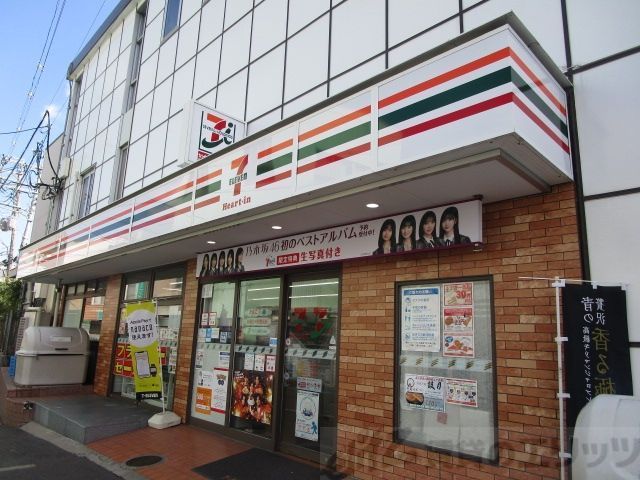 コンビニ　セブンイレブンハートインJR千里丘駅西口店（コンビニ）まで180m
