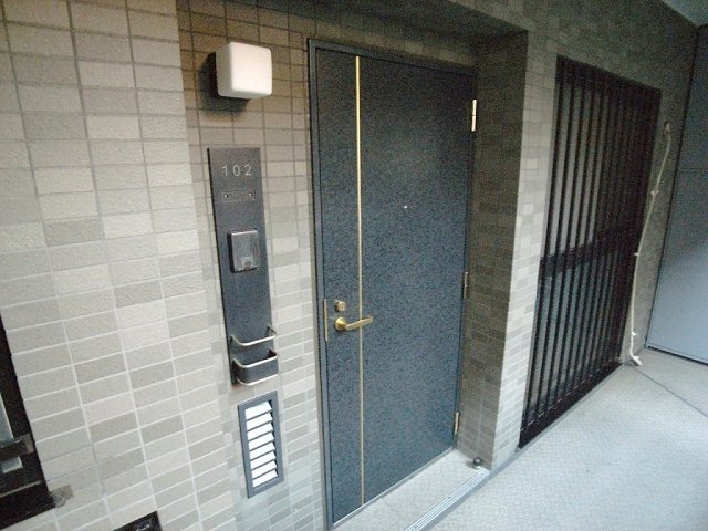 都営三田線 千石駅 徒歩7分 9階建 築30年の玄関写真