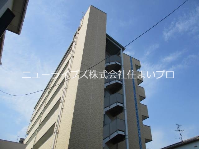 寝屋川市萱島本町のマンションの建物外観