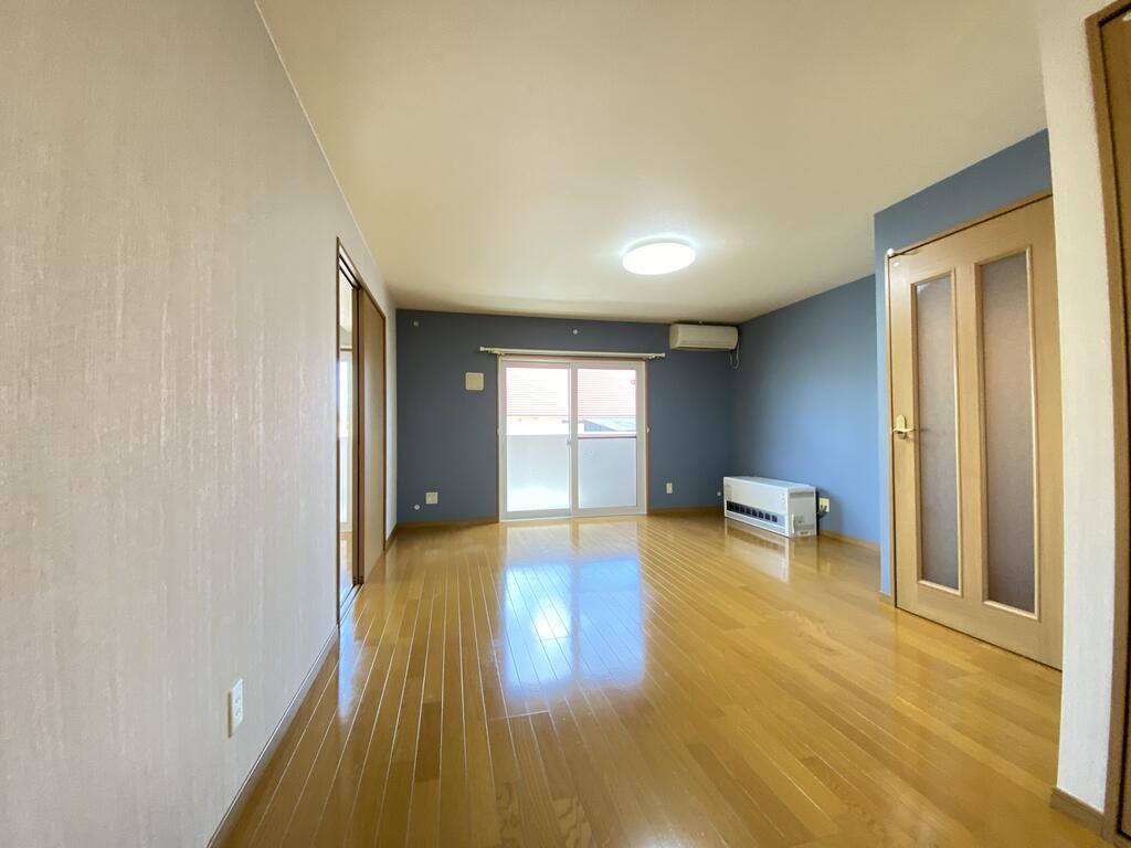名寄市西10条南10丁目2LDKマンションの居間写真